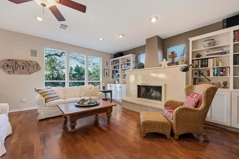 a living room with furniture and a fireplace