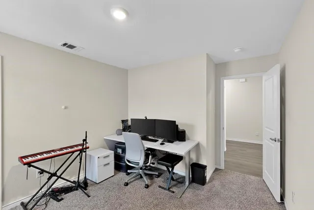 a view of a workspace with furniture