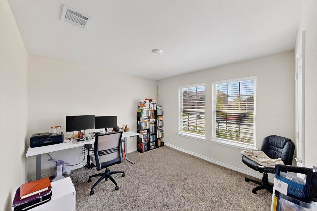 504 Willow View Way Princeton, TX 75407 - Photo 15 of 21 a view of a workspace with furniture and a window