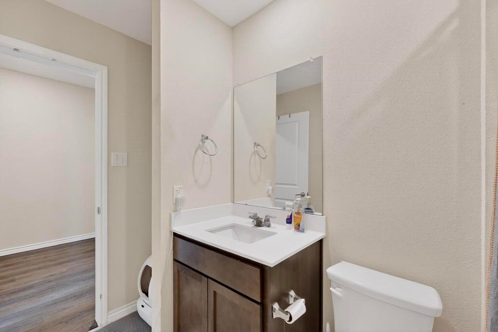 504 Willow View Way Princeton, TX 75407 - Photo 16 of 21 a bathroom with a sink and a toilet