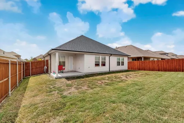 a big yard with table and chairs