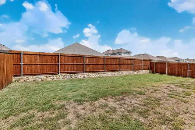 a view of a backyard with a garden