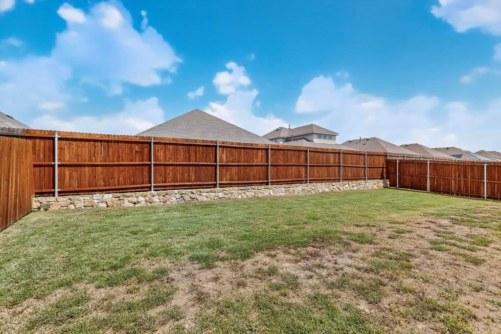 504 Willow View Way Princeton, TX 75407 - Photo 21 of 21 a view of a backyard with a garden