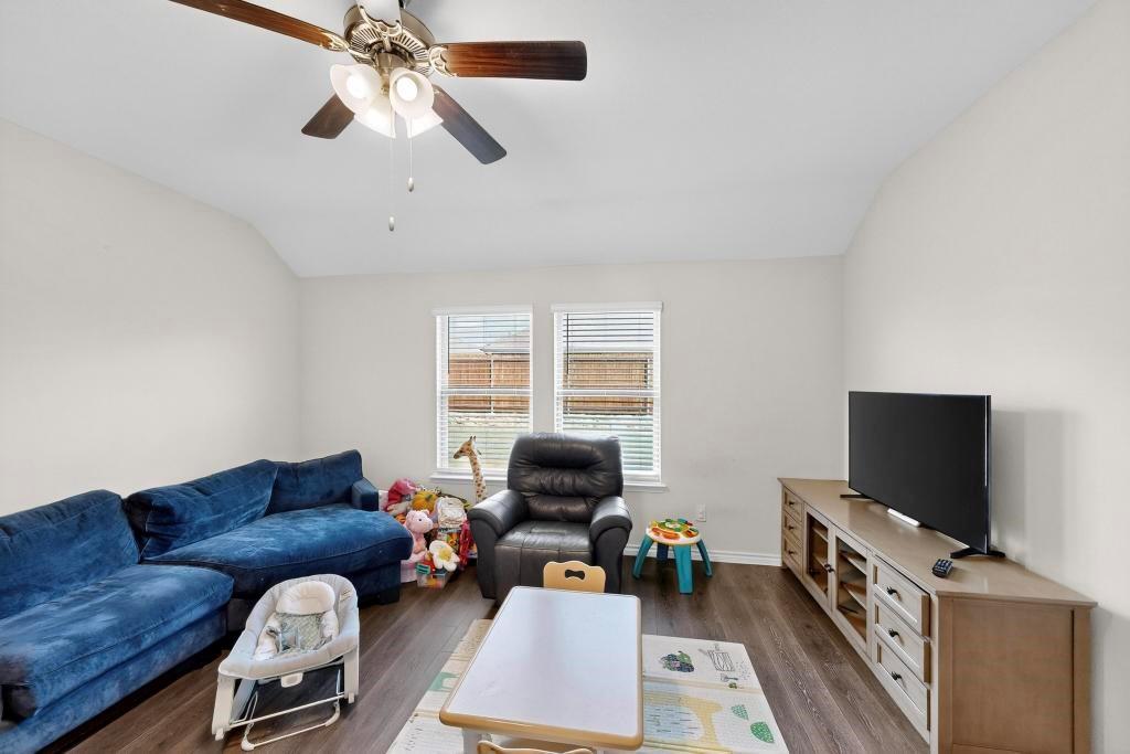 504 Willow View Way Princeton, TX 75407 - Photo 3 of 21 a living room with furniture and a flat screen tv