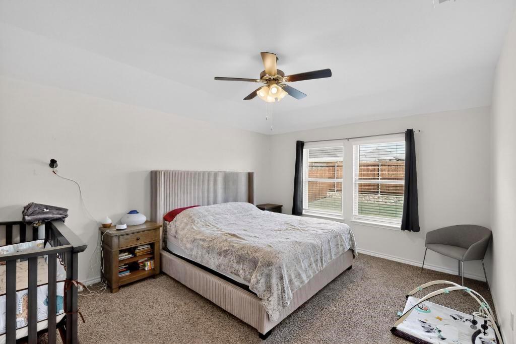 504 Willow View Way Princeton, TX 75407 - Photo 8 of 21 a bedroom with a bed and a window