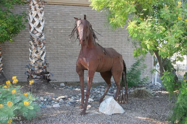 a view of two chairs in a backyard