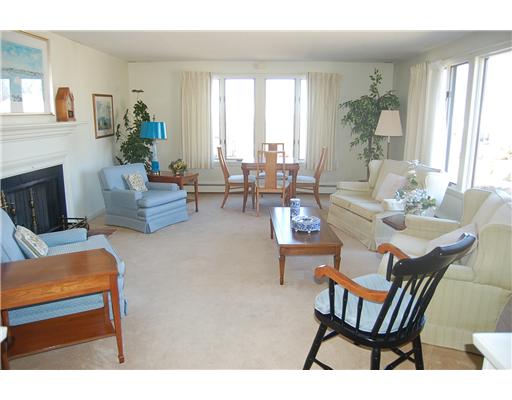14 Hanley Farm Road, Unit 14 Warren, RI 02885 - Photo 2 of 11 Living Room. A very spacious living room with fireplace, built-in book shelves and great views.