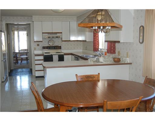 14 Hanley Farm Road, Unit 14 Warren, RI 02885 - Photo 6 of 11 Den/Family/Great Room. Sun-filled kitchen and dining area open to family room with hardwood floors and brick fireplace.