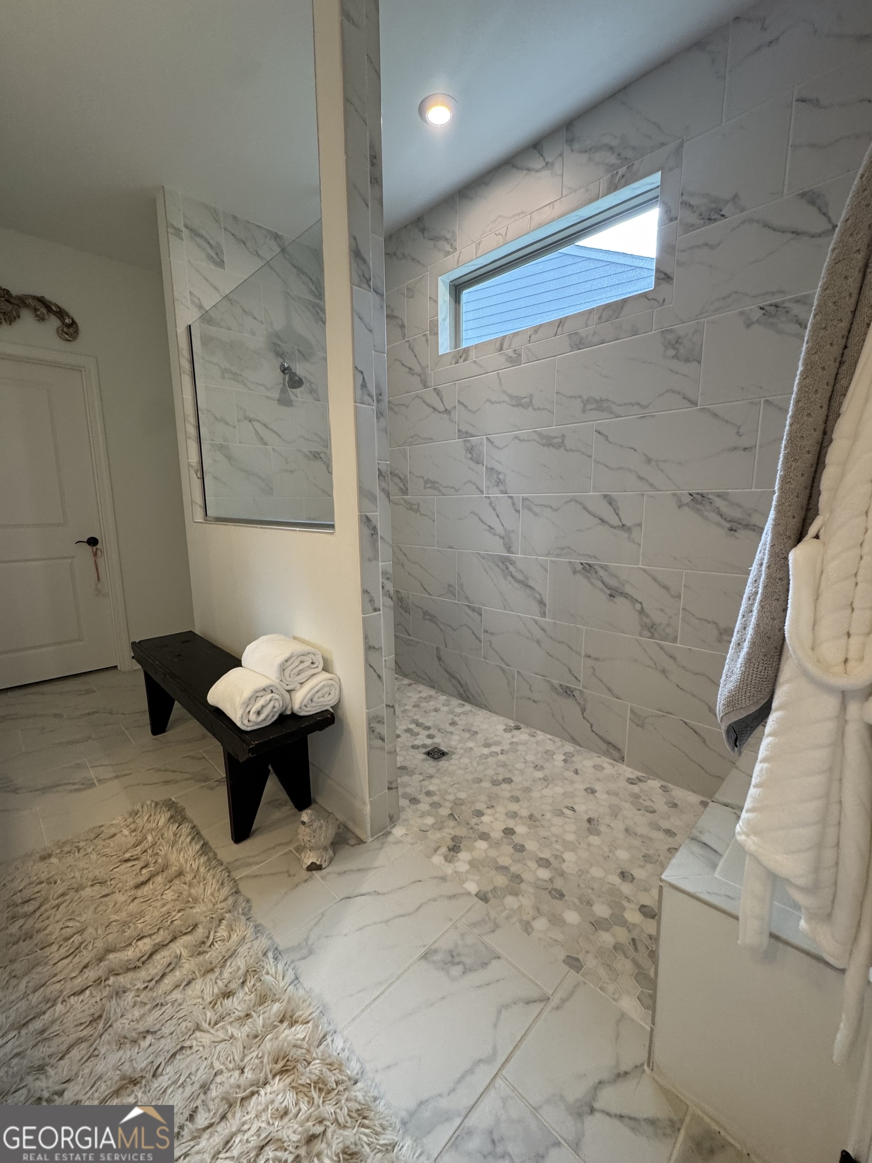 5947 Maple Bluff Way Hoschton, GA 30548 - Photo 19 of 32 a bathroom with a sink toilet and shower