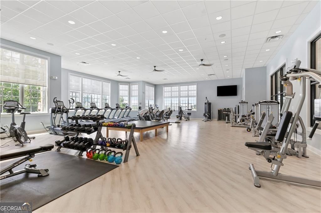 5947 Maple Bluff Way Hoschton, GA 30548 - Photo 21 of 32 a view of a room with gym equipment