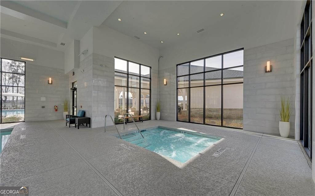 5947 Maple Bluff Way Hoschton, GA 30548 - Photo 24 of 32 a view of an empty room with a window