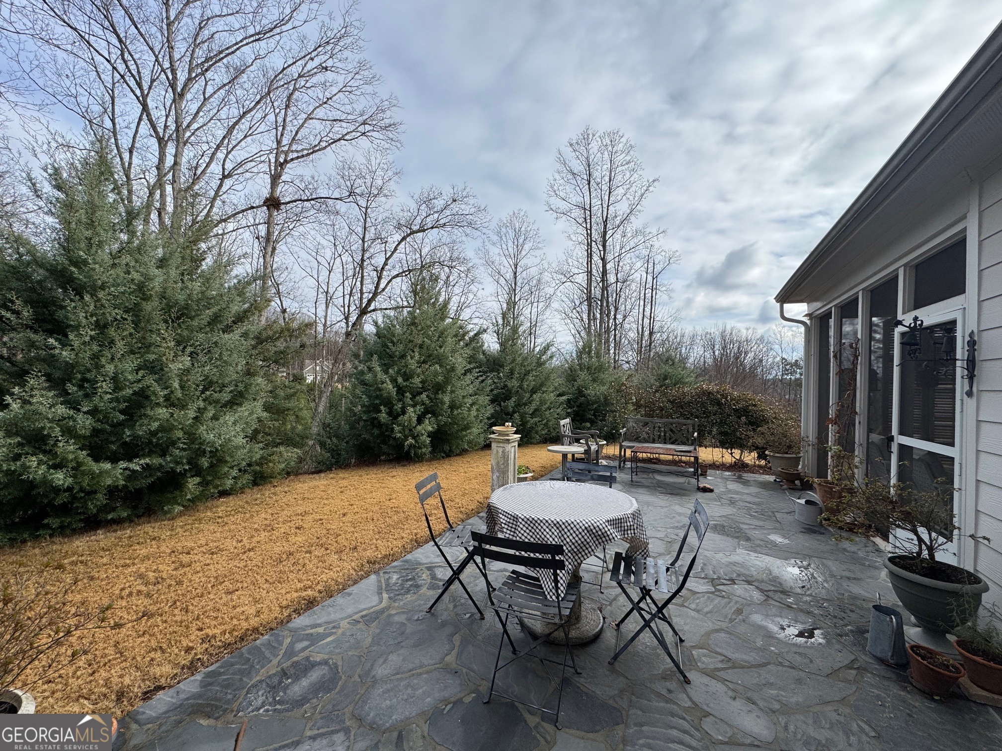 5947 Maple Bluff Way Hoschton, GA 30548 - Photo 30 of 32 a view of a backyard with sitting area