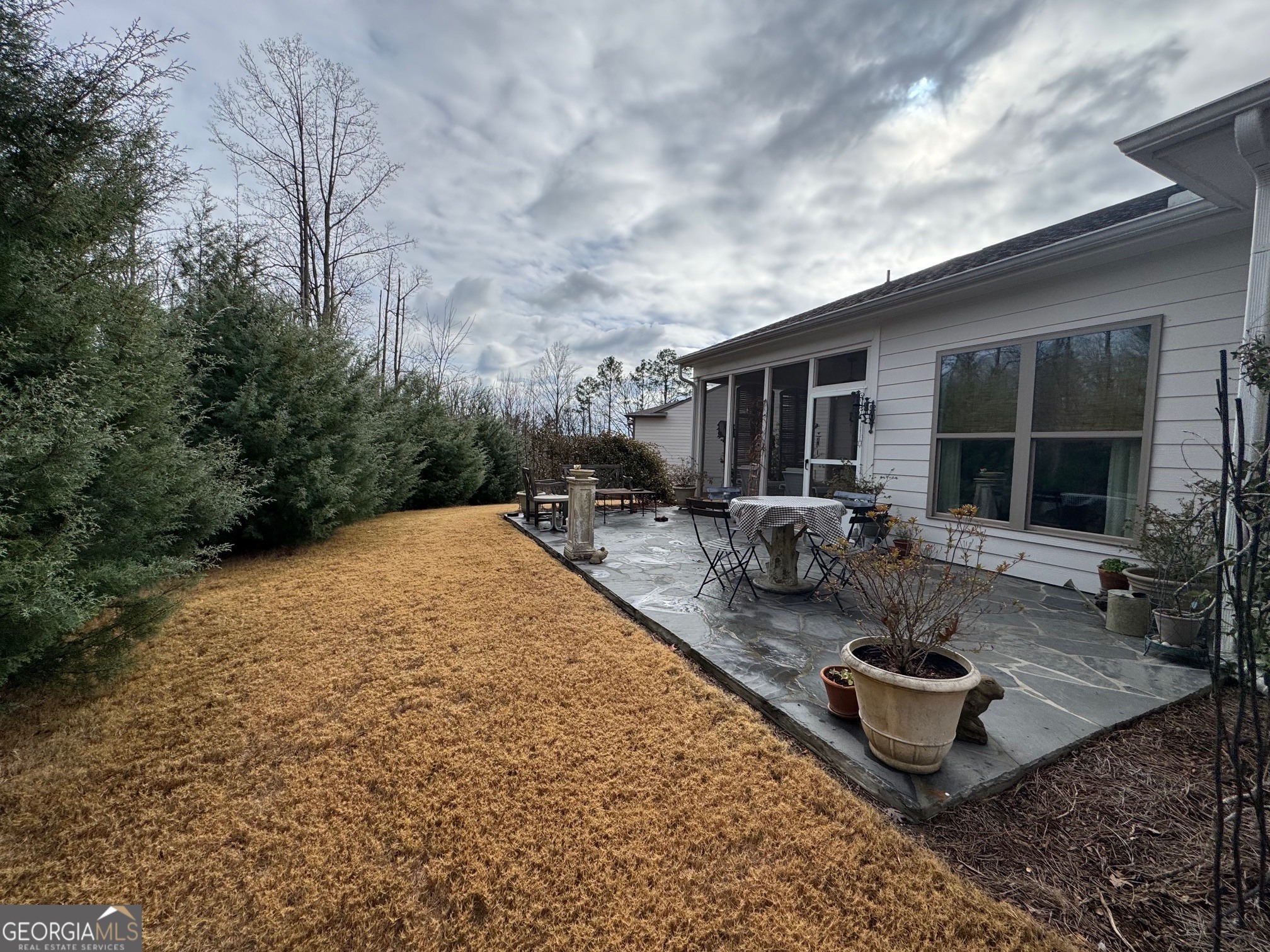 5947 Maple Bluff Way Hoschton, GA 30548 - Photo 31 of 32 a view of a backyard with sitting area