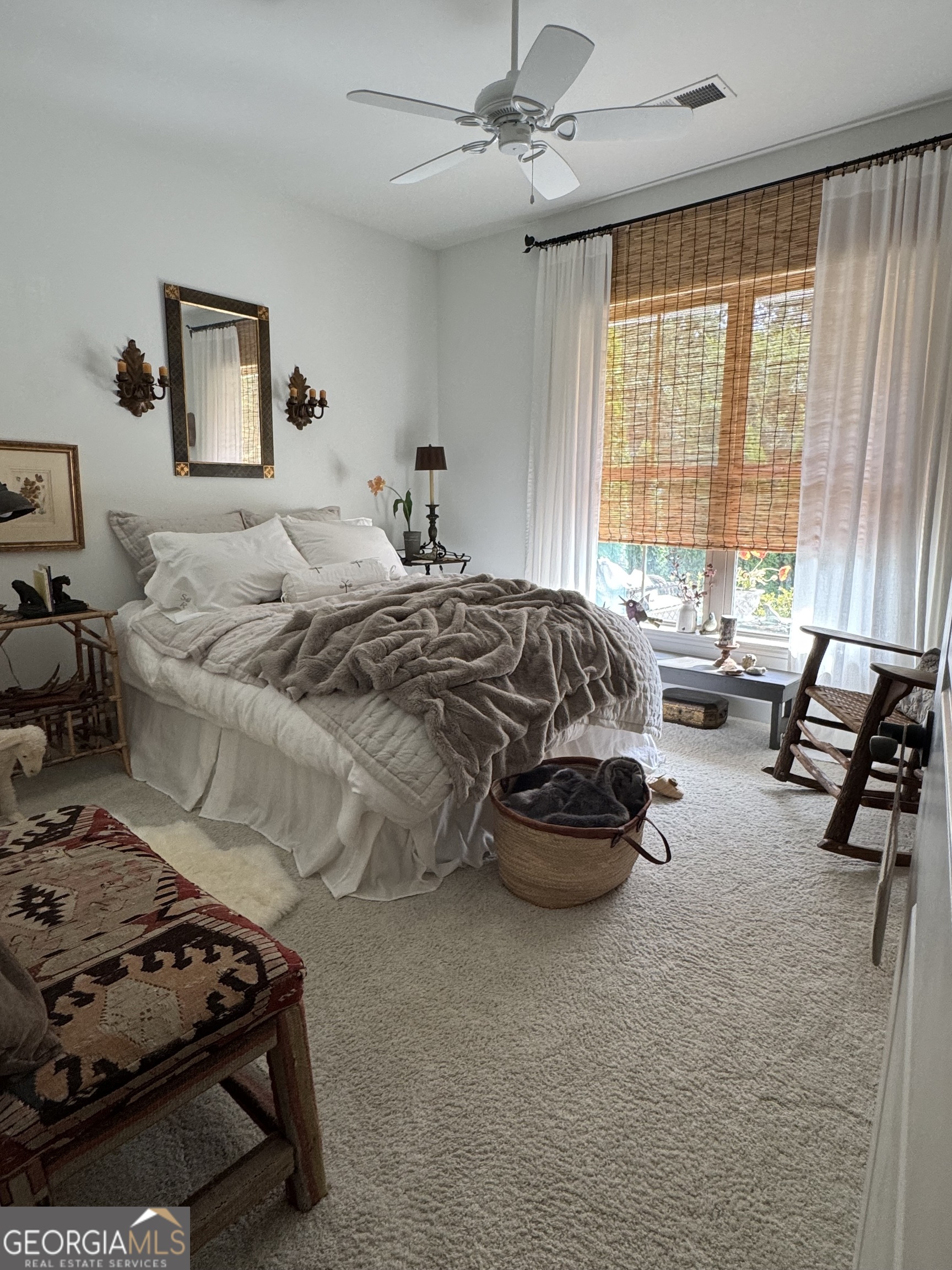 5947 Maple Bluff Way Hoschton, GA 30548 - Photo 6 of 32 a bedroom with a bed and a couch