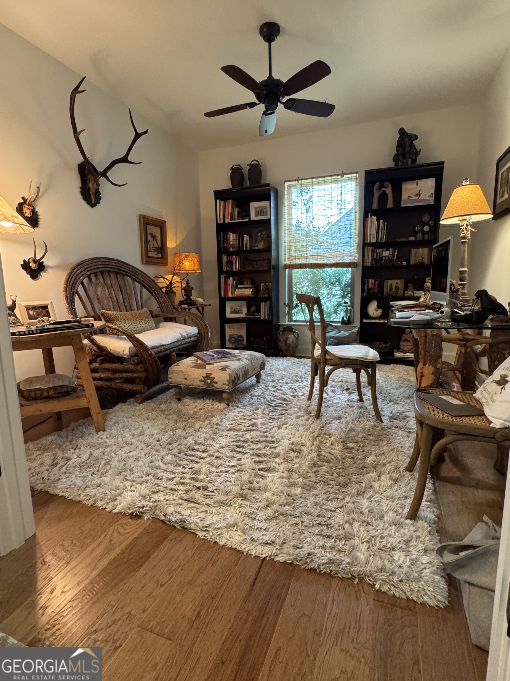 5947 Maple Bluff Way Hoschton, GA 30548 - Photo 8 of 32 a living room with furniture rug and window