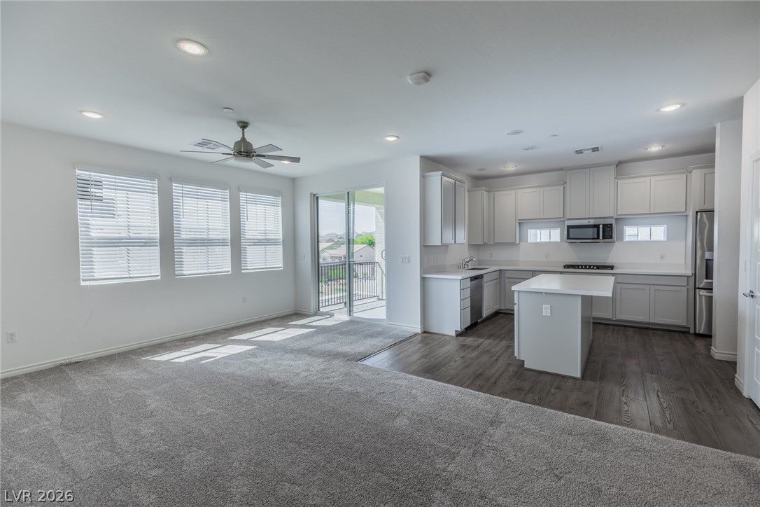 2555 Hampton Road, Unit 8206 Henderson, NV 89052 - Photo 7 of 35 This bright kitchen and living area features sleek finishes and an open-concept layout.