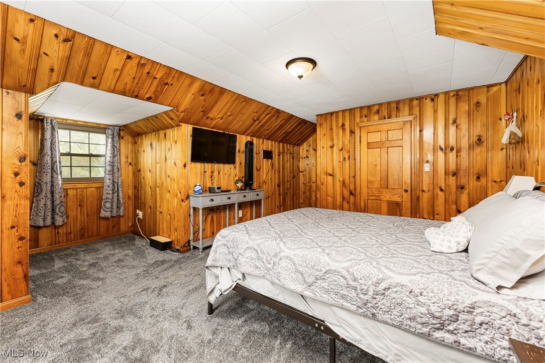 6254 Stanbury Road Parma, OH 44129 - Photo 32 of 44 Bedroom with wood walls and carpet floors