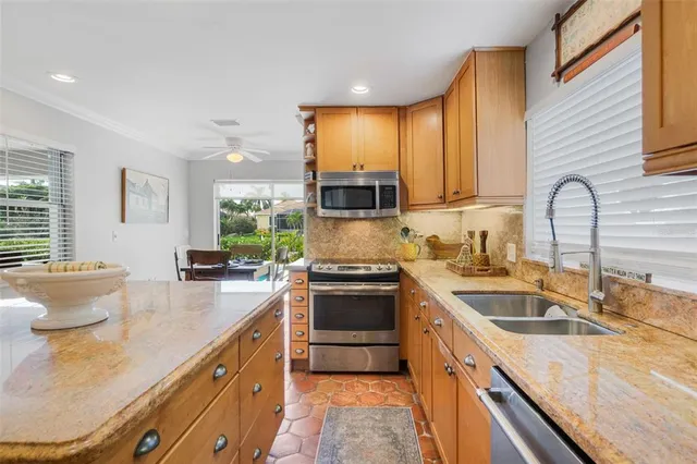 a kitchen with a sink stove and cabinets