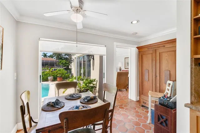 a dining room with furniture and window