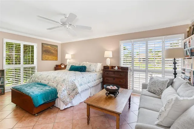 a spacious bedroom with a bed and a couch