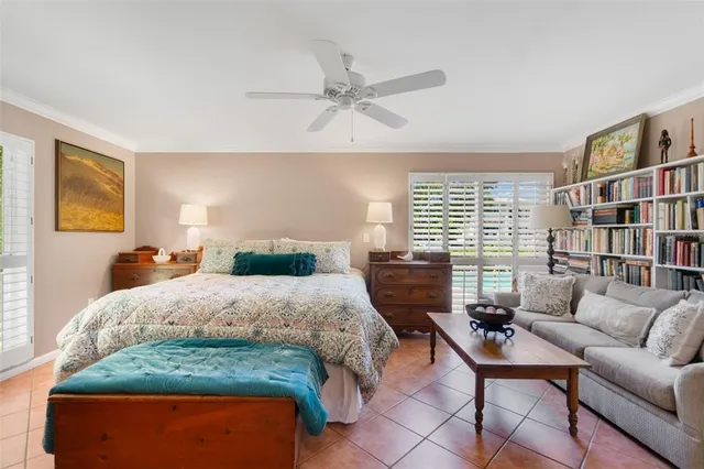 a bedroom with a bed furniture and a window