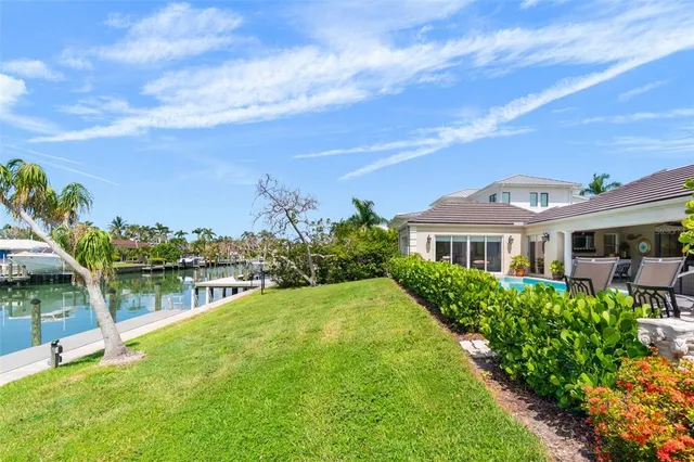 an aerial view of residential building and lake