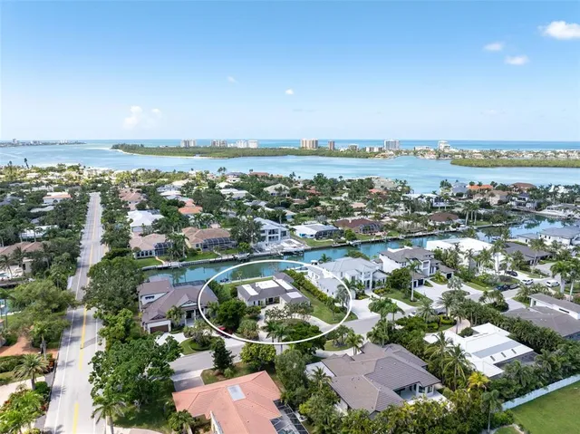 an aerial view of a house with yard lake and lake view