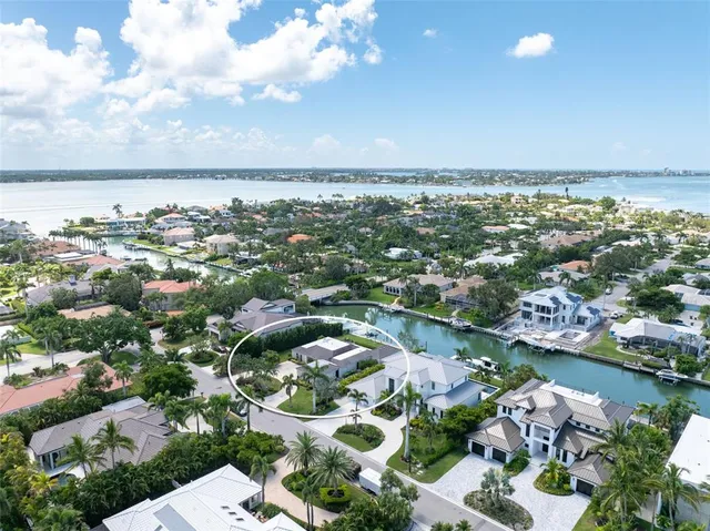 a front view of a building with an outdoor space and seating area