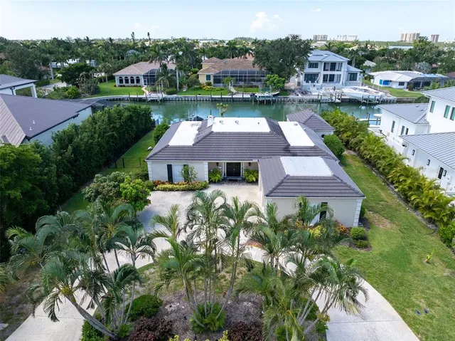 a front view of multi story building with yard
