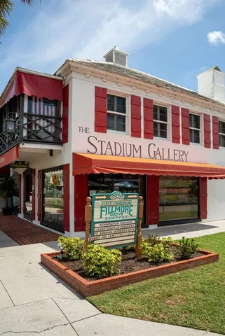 a view of a cafe with sitting area