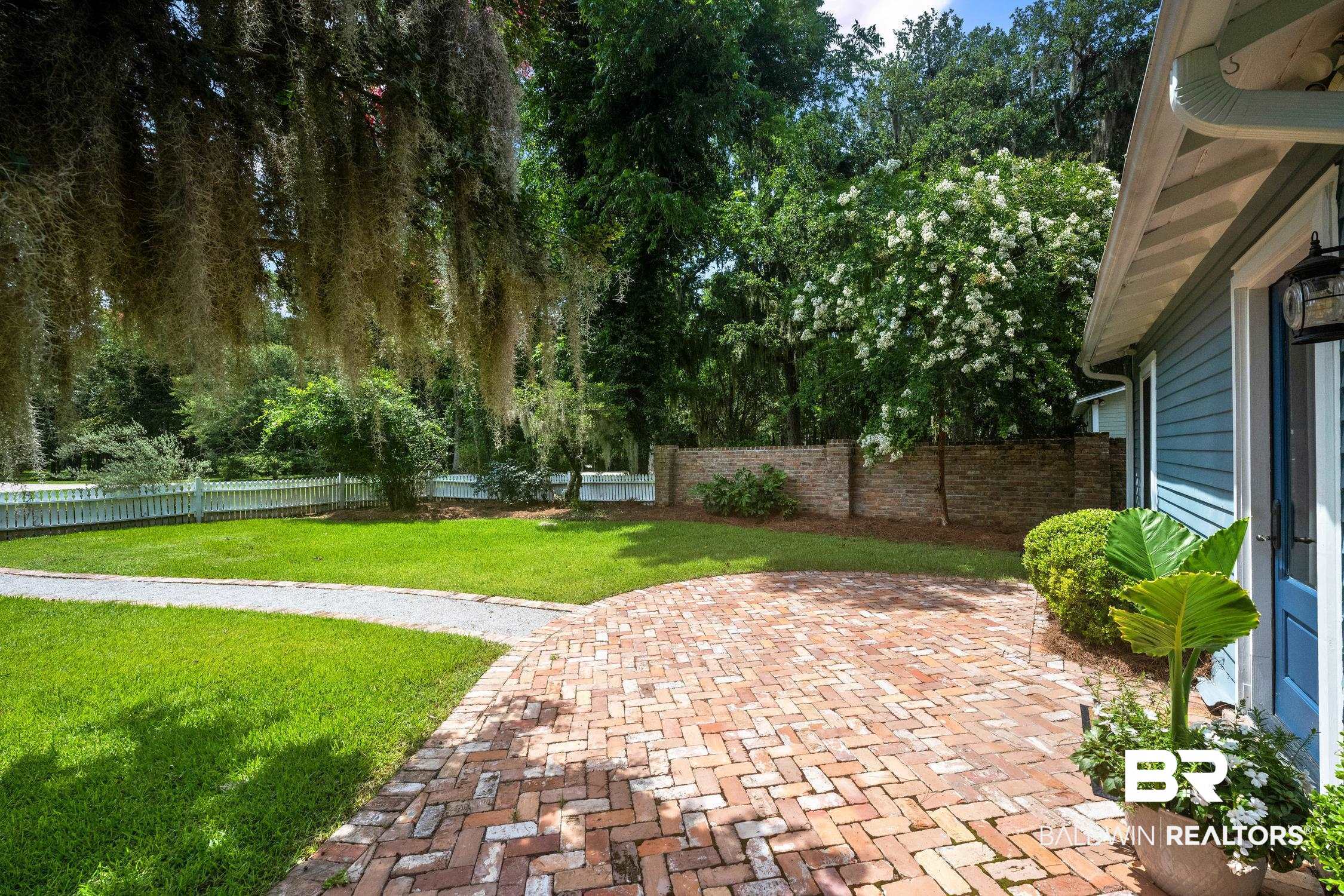 5490 Battles Road Fairhope, AL 36532 - Photo 3 of 47 Brick paver driveway with a herringbone pattern