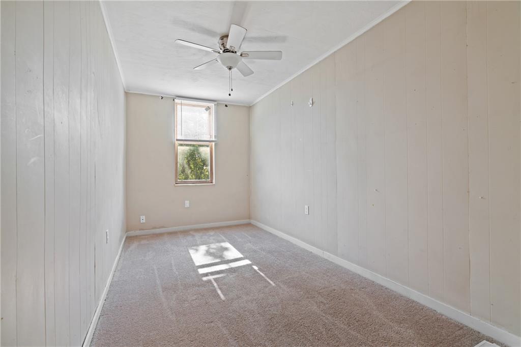 2123 Lautner Street Pittsburgh, PA 15212 - Photo 14 of 32 an empty room with windows and fan