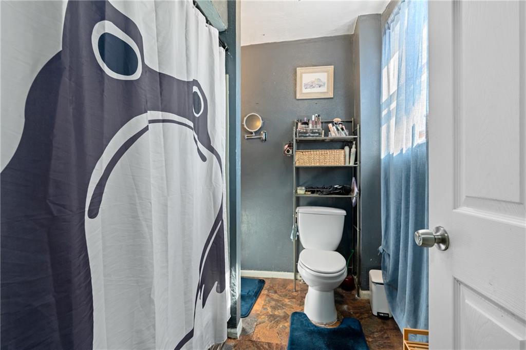 2123 Lautner Street Pittsburgh, PA 15212 - Photo 22 of 32 a bathroom with a toilet and a shower