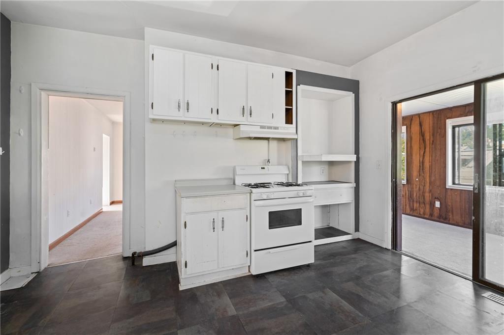 2123 Lautner Street Pittsburgh, PA 15212 - Photo 6 of 32 a kitchen with white cabinets and white appliances