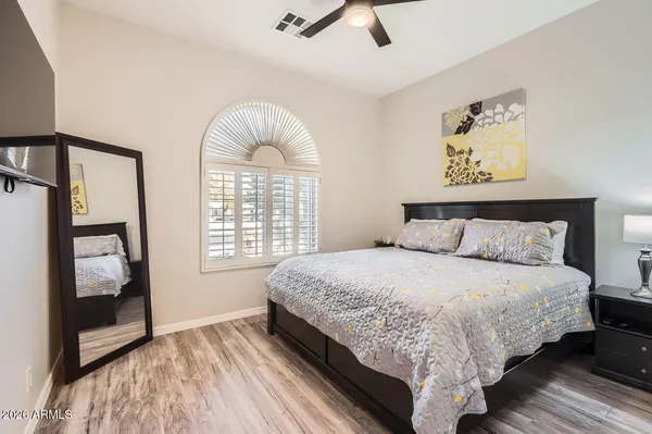 a bedroom with bed and window