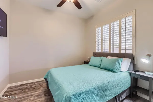 a bedroom with a bed and window