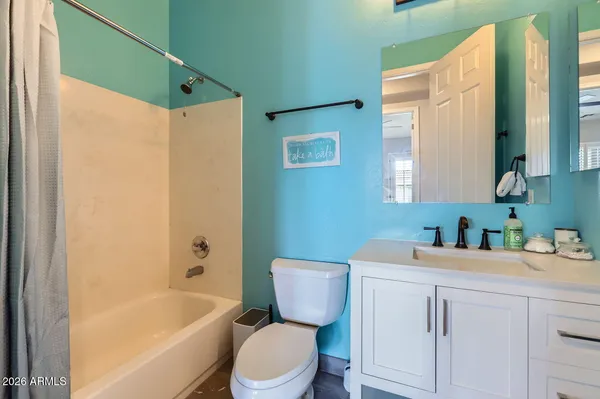 a bathroom with a sink a toilet and bathtub