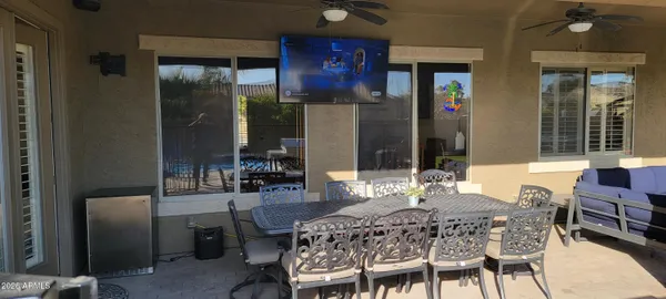 a view of an house with backyard space and patio