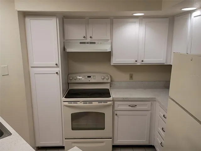 a kitchen with a stove and a sink