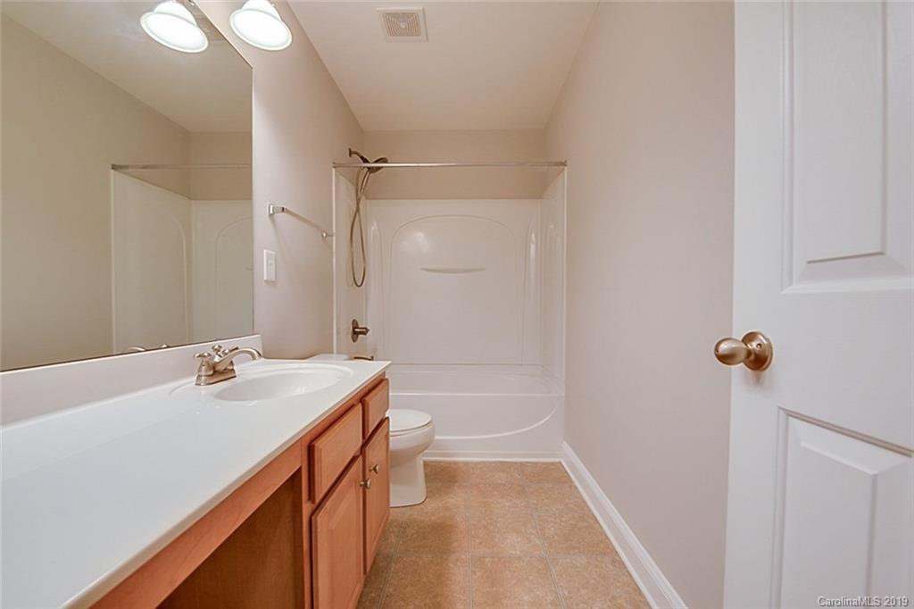 234 River Clay Road Fort Mill, SC 29708 - Photo 12 of 15 a bathroom with a sink a toilet and shower