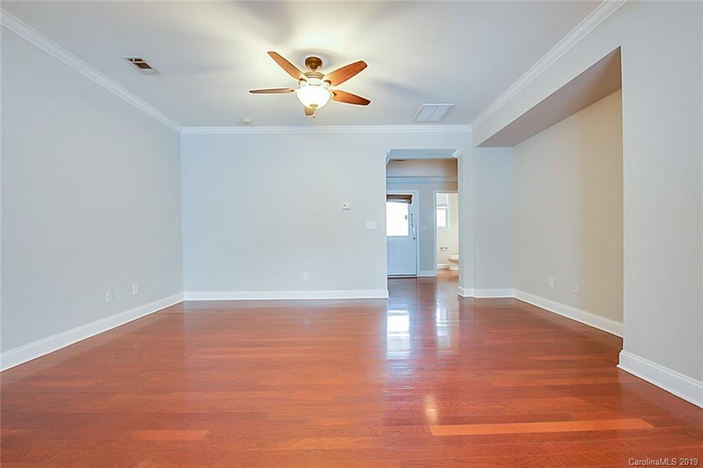 234 River Clay Road Fort Mill, SC 29708 - Photo 3 of 15 a view of an empty room with wooden floor and a window