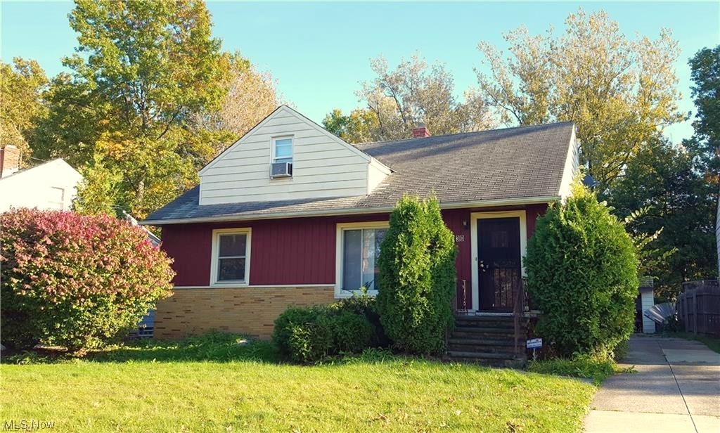 View of front of property with a front yard