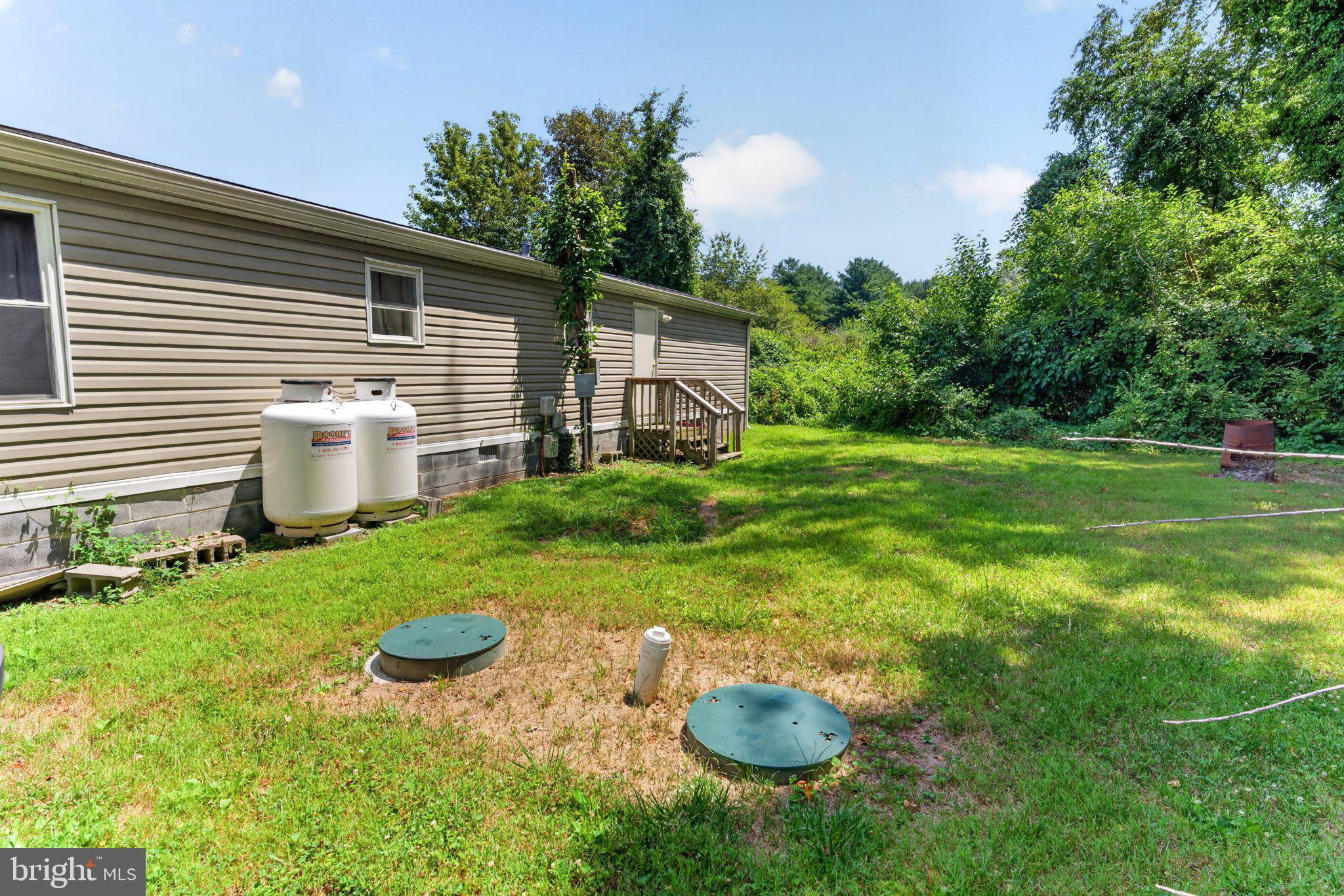 90 Cove Road Dover, DE 19904 - Photo 38 of 39 Spacious backyard with lush greenery.