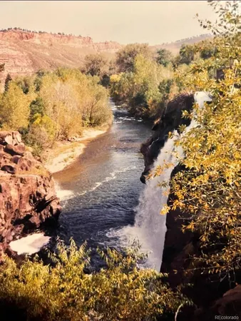 a view of ocean with a mountain