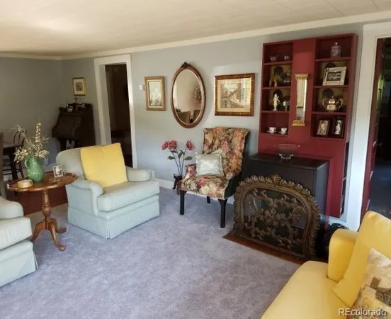 a living room with furniture and large windows