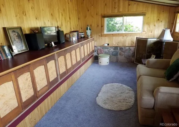 a kitchen with granite countertop wooden cabinets and a sink