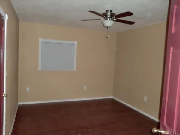 a kitchen with a refrigerator and a window