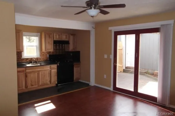a view of hallway with wooden floor