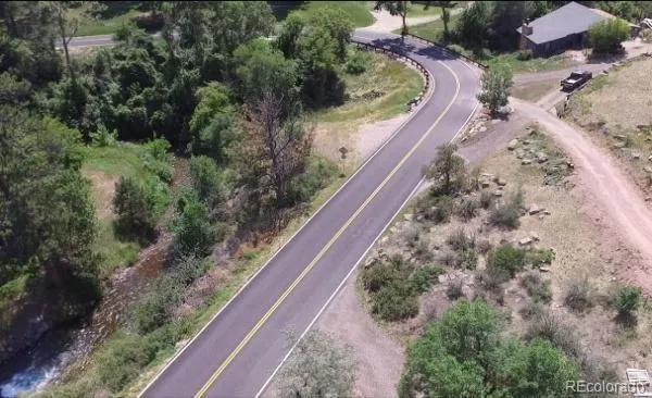 an aerial view of a house with a lake view