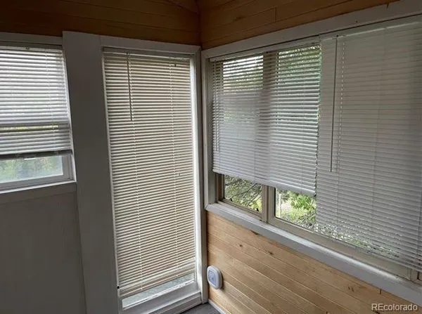 a view of a door and a window